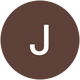 Logo with a brown circular background and a white letter J in the center.