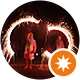 Person holding sparkler creating light trail at night.
