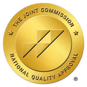 The Joint Commission gold seal with National Quality Approval text and geometric shapes.