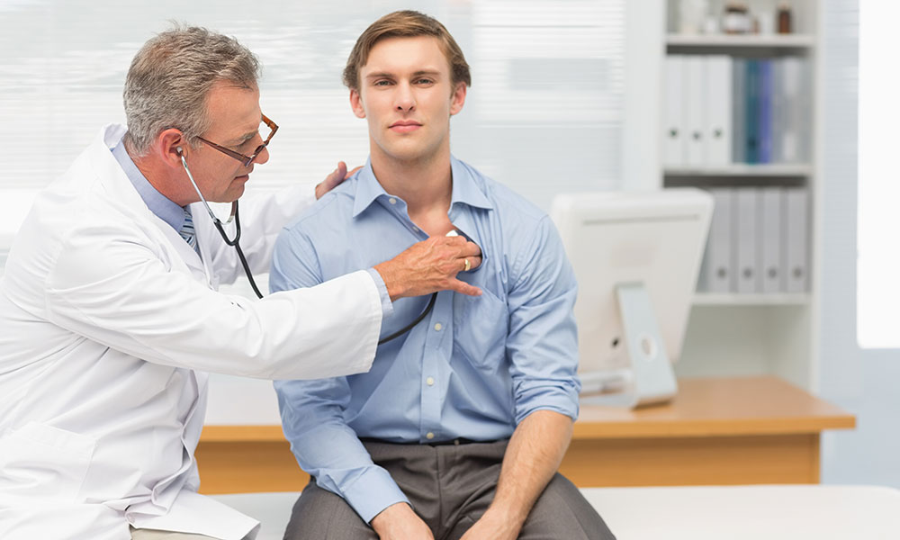 Doctor Supporting the Man with Chest Pain